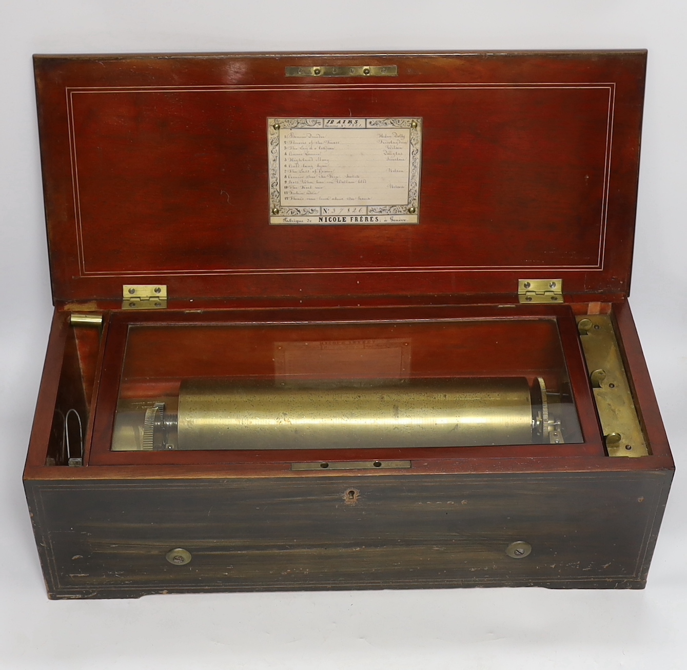 A late 19th century Swiss rosewood inlaid cylinder music box by Nicole Freres, playing twelve airs on one hundred and twenty-nine teeth, barrel 31cm wide, case 53cm wide, 22.5cm deep, 17cm high